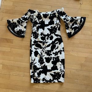 Premier Amour Size 12 off the shoulder black and white floral dress. Back slit.